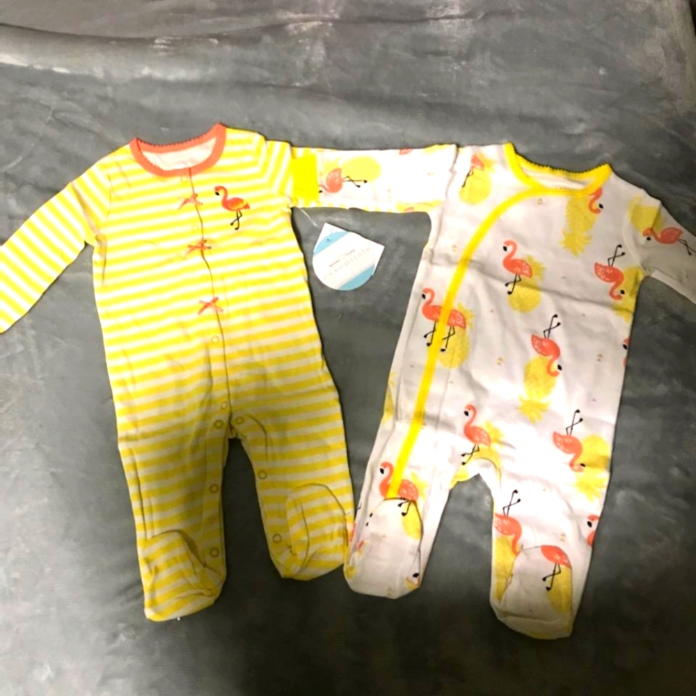 NWT. 2 peice yellow and pink sleep and play outfits. 3-6mos